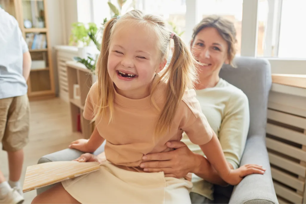 Mother and child smiling together in supportive dental environment