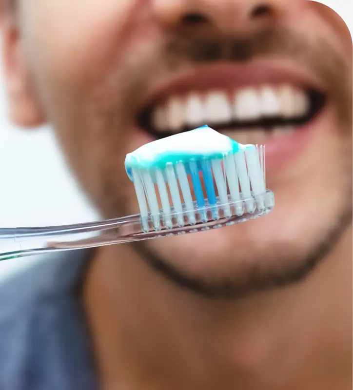 Pediatric dentist performing gentle dental cleaning